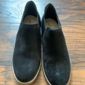 Clark’s black shoes, never worn
